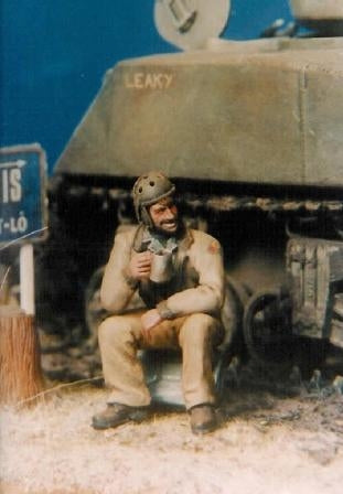 U S Tanker sitting drinking from a canteen cup 1944