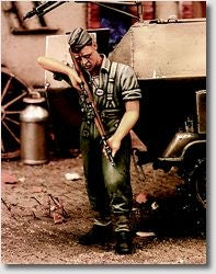 German Soldier cleaning rifle 1943