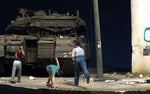 Boys throwing stones